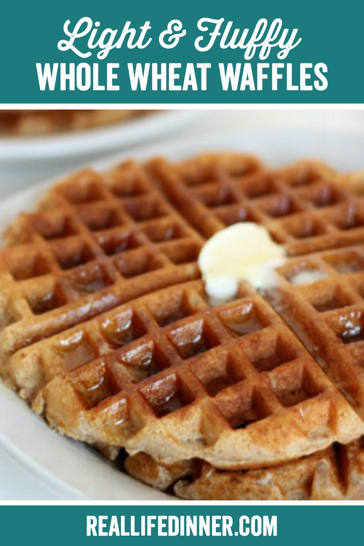 waffles on a white plate with a dollop of butter and syrup on them