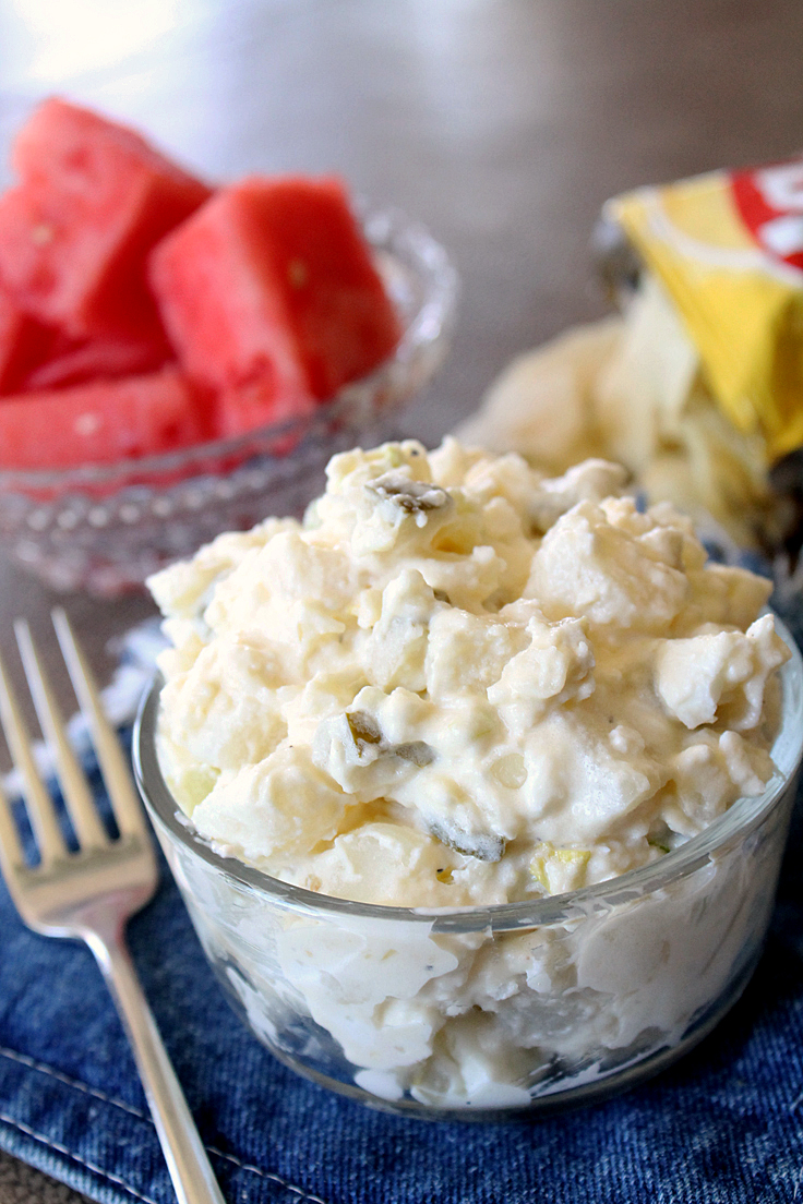 bowl of potato salad with chips and watermelon
