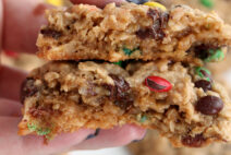 close up of a cookie cut in half with M&Ms and chocolate chips