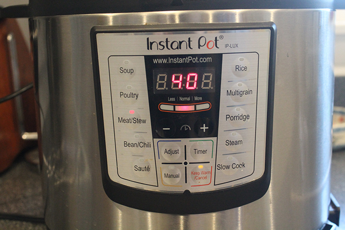 Instant pot showing the time amount you need to cook the chicken stock