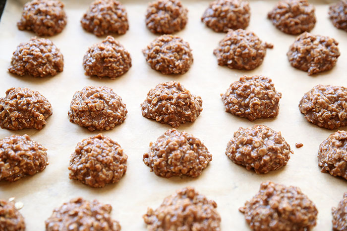 rows of chocolate, peanut butter cookies on parchment paper