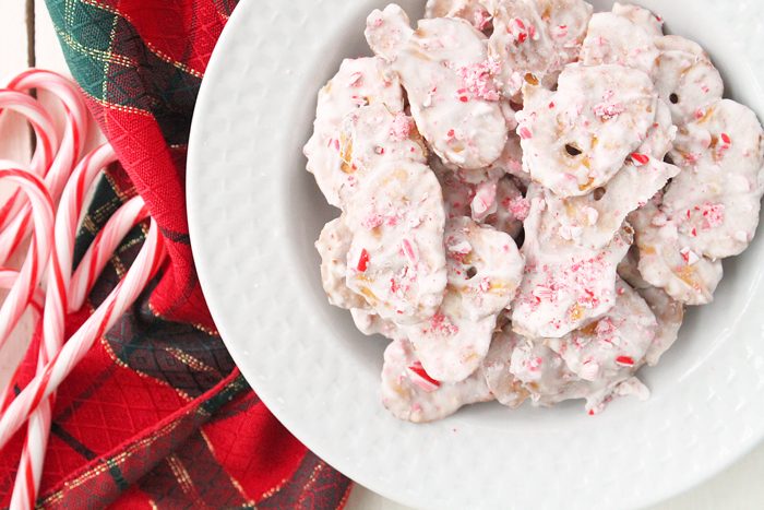 white chocolate pretzel crisps with crushed candycanes, red table cloth inthe background