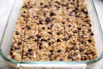 A glass 9x13 pan of cut peanut butter and chocolate chip granola bars.