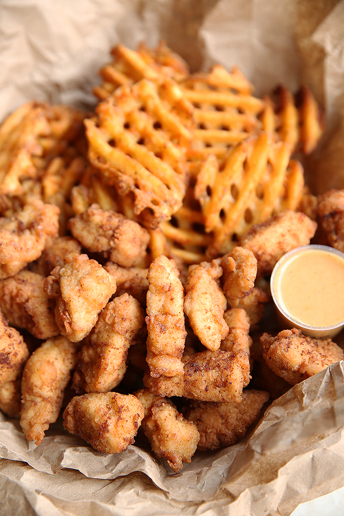 a basket of chick-fil-a copycat chicken nuggets with a side of chick-fil-a sauce