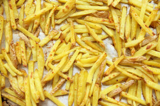 A sheet pan full of Oven-Baked French Fries.
