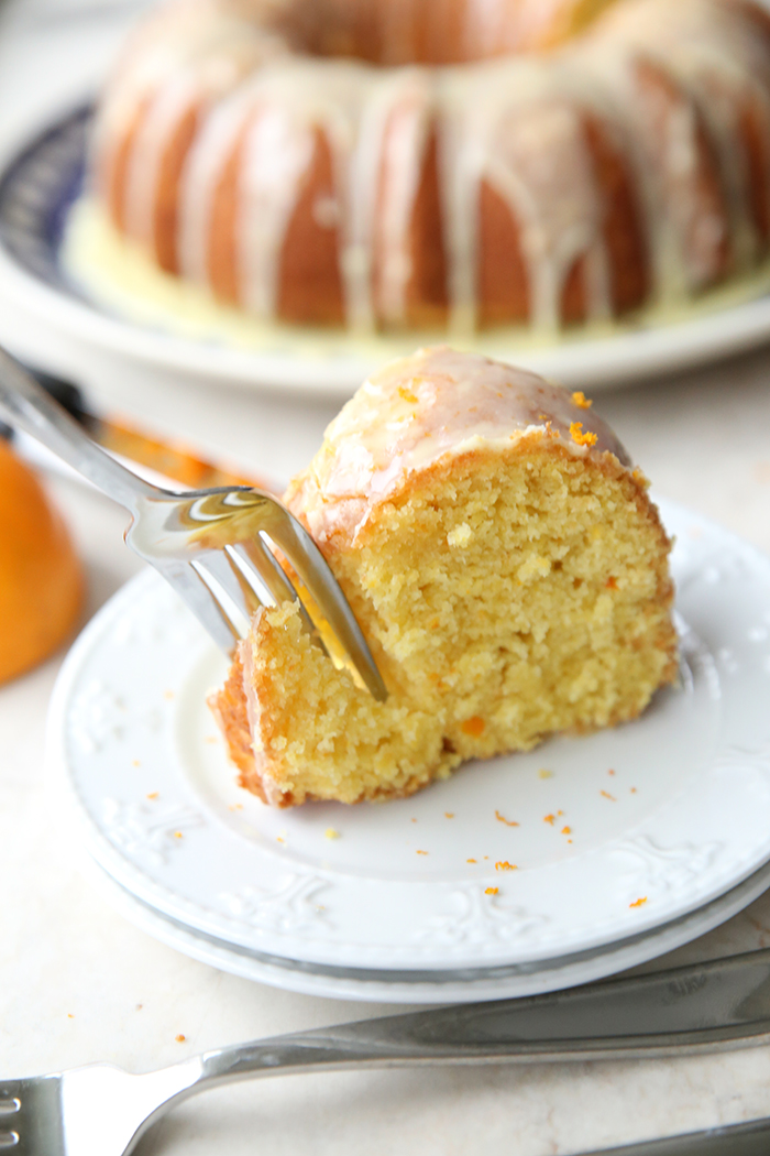 A fork plunging into a soft and moist Whole Orange Cake
