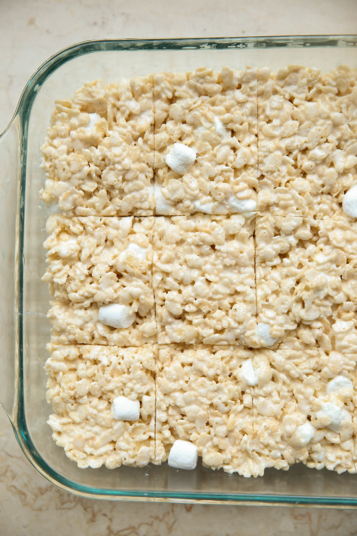 A partial picture of a 9x13 glass dish of The Best Rice Krispie Treats