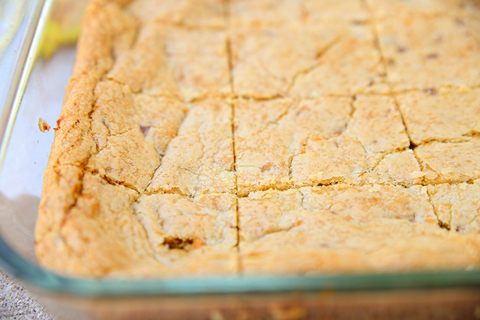 a pan of delicious cut butterfinger blondie cookie bars