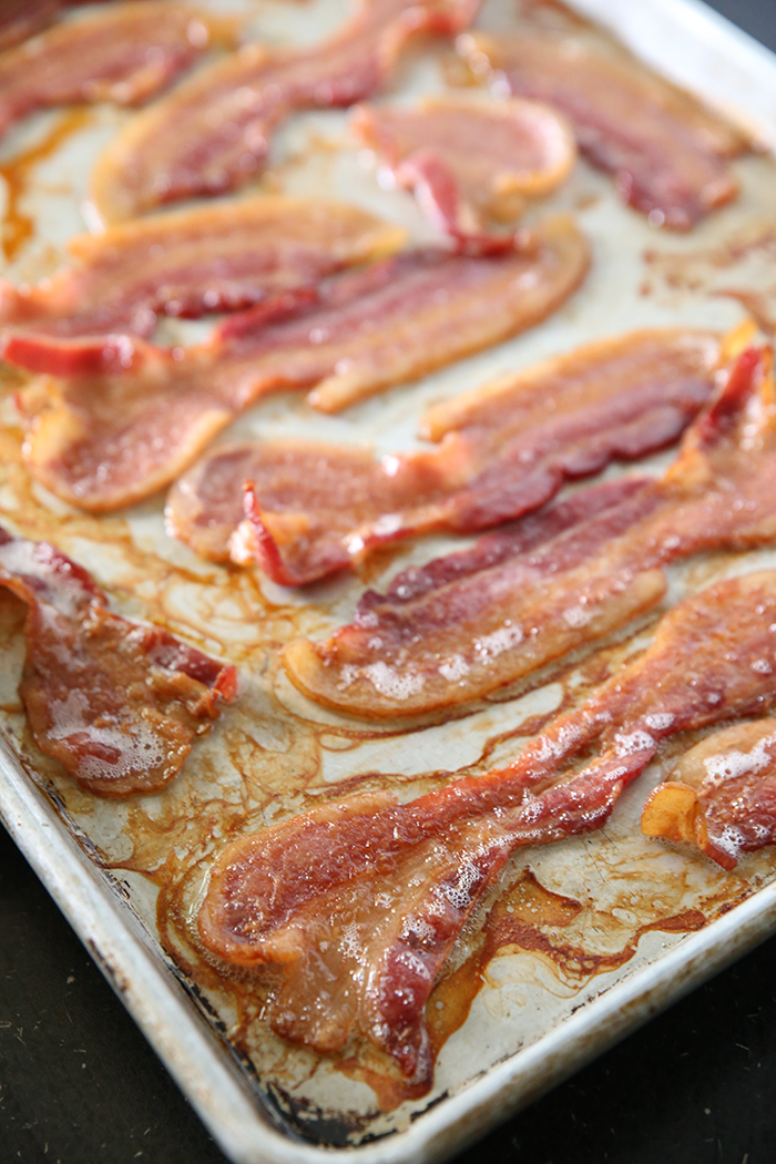 A baking sheet full of cooked bacon.