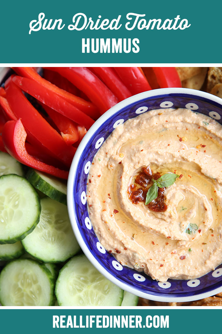 Pinterest picture with the text of the title Sun Dried Tomato Hummus at the top.