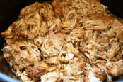 A slow cooker full of copycat cafe rio shredded chicken.