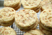 Stacks of soft and chewy toffee cookies on a wire cooling rack.