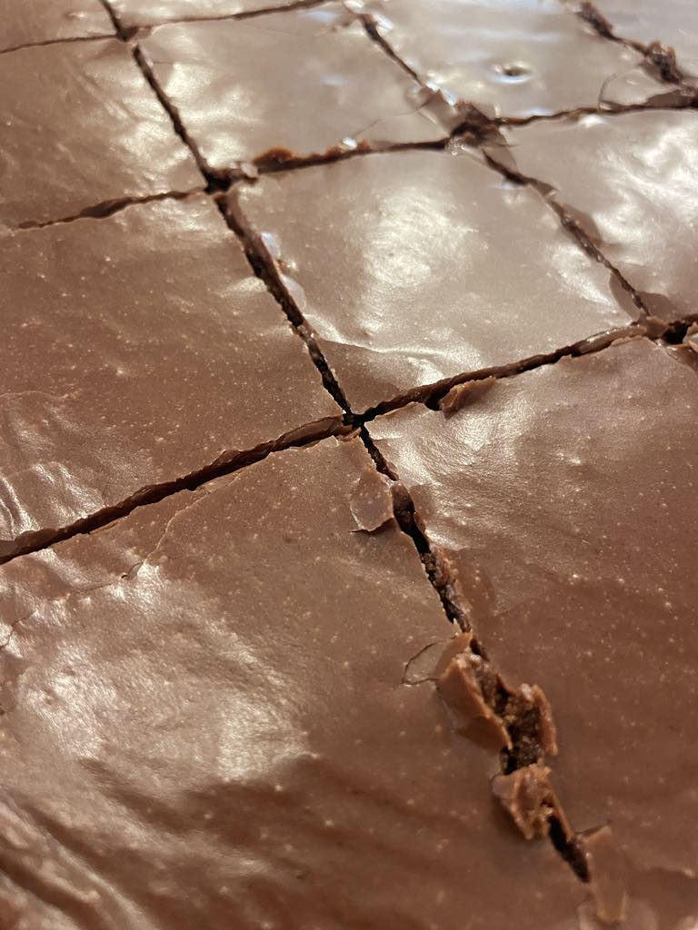 Texas sheet cake cut into squares.