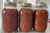 Three quart-size jars of homemade salsa.